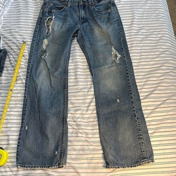 American Eagle Denim Low Rise Boot. Waist: 34 Inseam 31 Inches - Picture 9 of 14